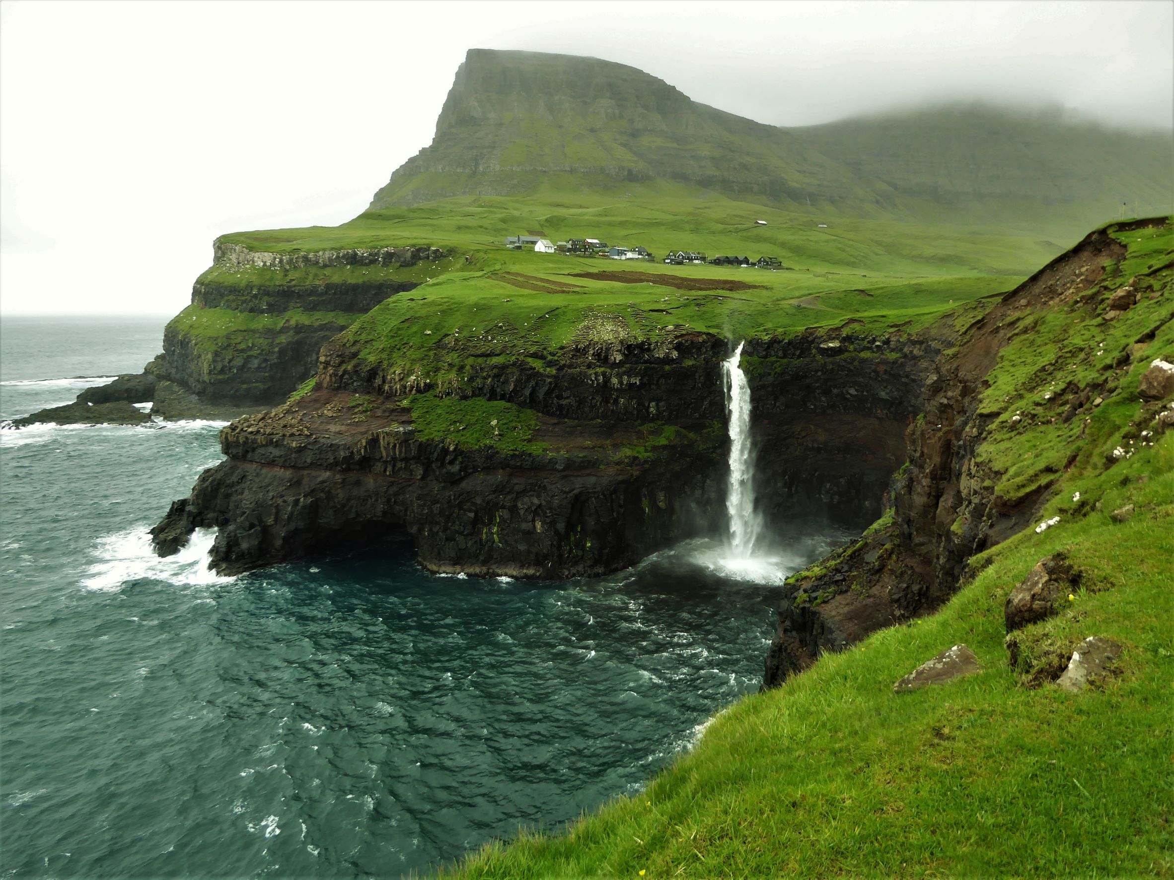 Waterfall going down the cliffs
